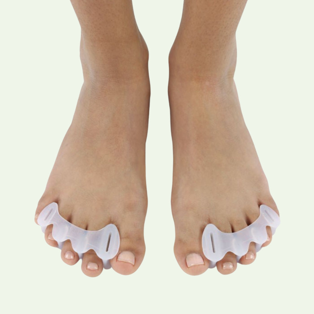 Adjustable toe spreader